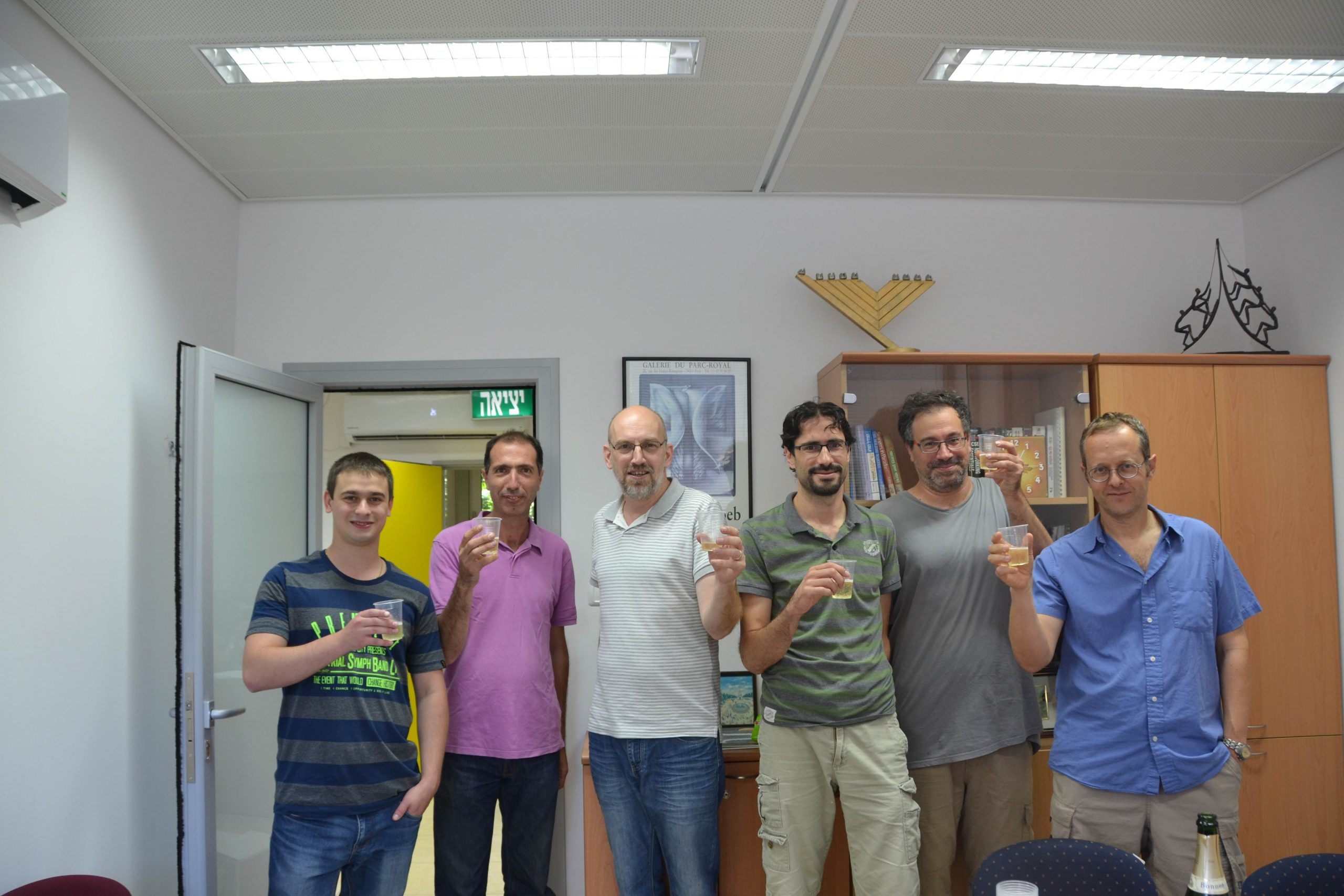 Igor Chebotar, Yair Bellehsen, Nimrod Lahav, Eyal Privman, Doron Chelouche, and Mickey Kosloff raising their glasses in honor of the Hive